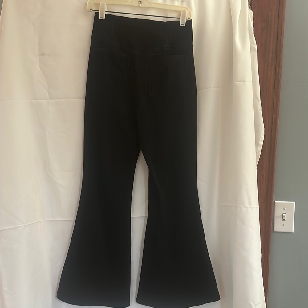 Black Flared Halara Pants with 2 pockets and cross over waistband.